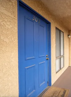 a view of bedroom with wooden floor
