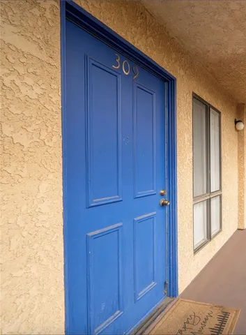 a view of bedroom with wooden floor
