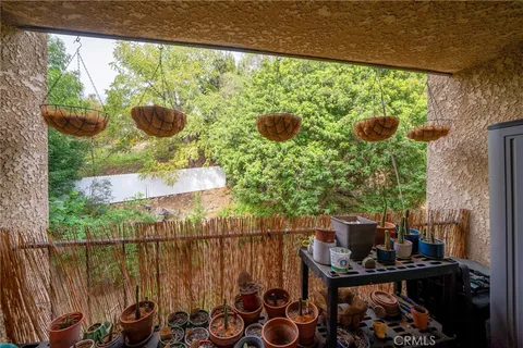 a view of a balcony with chairs