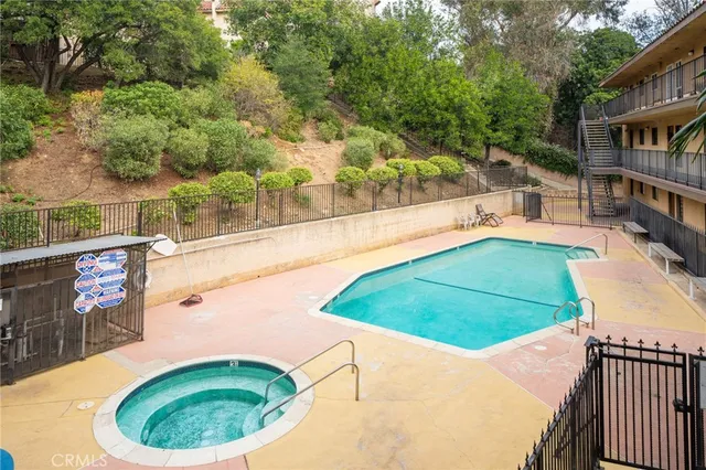 a view of a swimming pool with an outdoor seating