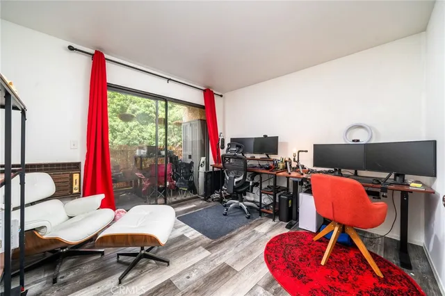 a room with gym equipment and a large window