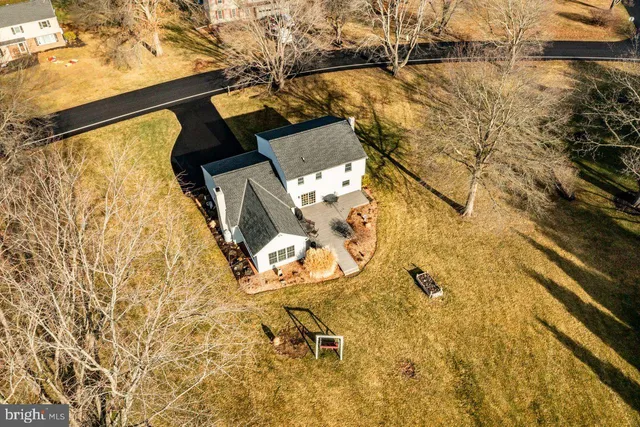 a backyard of a house with large trees