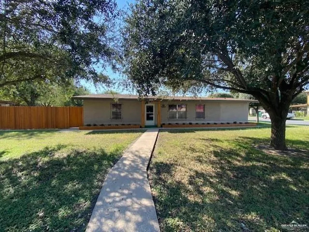 a swimming pool with outdoor seating and yard