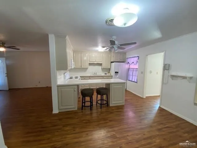 a open kitchen with a table and chairs