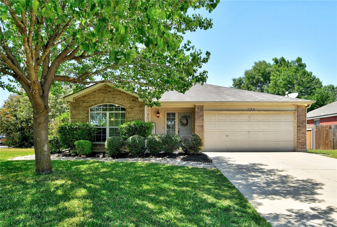 113 Jerry Lees Trail Kyle, TX 78640 - Photo 1 of 1 a front view of a house with garden