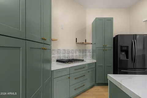 a bathroom with a granite countertop sink and vanity