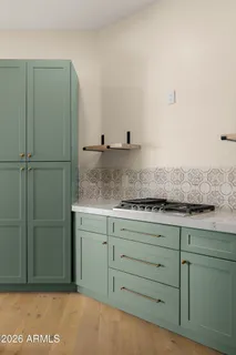 a bedroom with a bed and a night stand