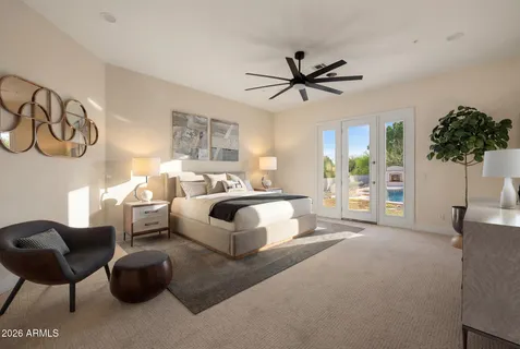 a bedroom with a bed and a painting on the wall