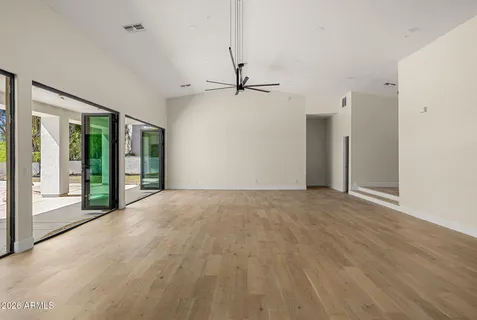 a kitchen with a sink cabinets stainless steel appliances and a center island