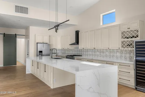a kitchen with a sink stove and refrigerator