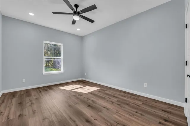 a bedroom with two beds and a window