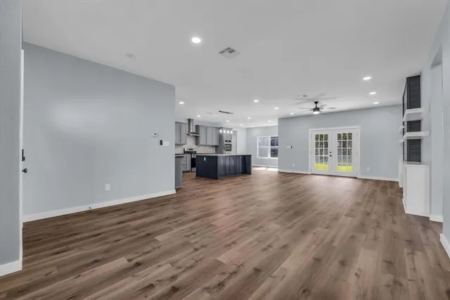 a view of kitchen with furniture and wooden floor
