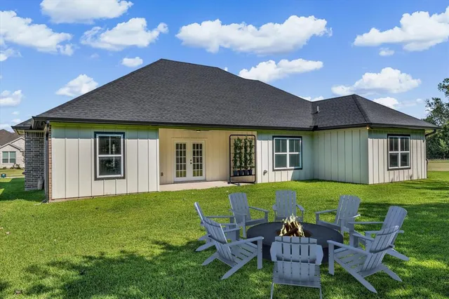 an aerial view of a house with a swimming pool