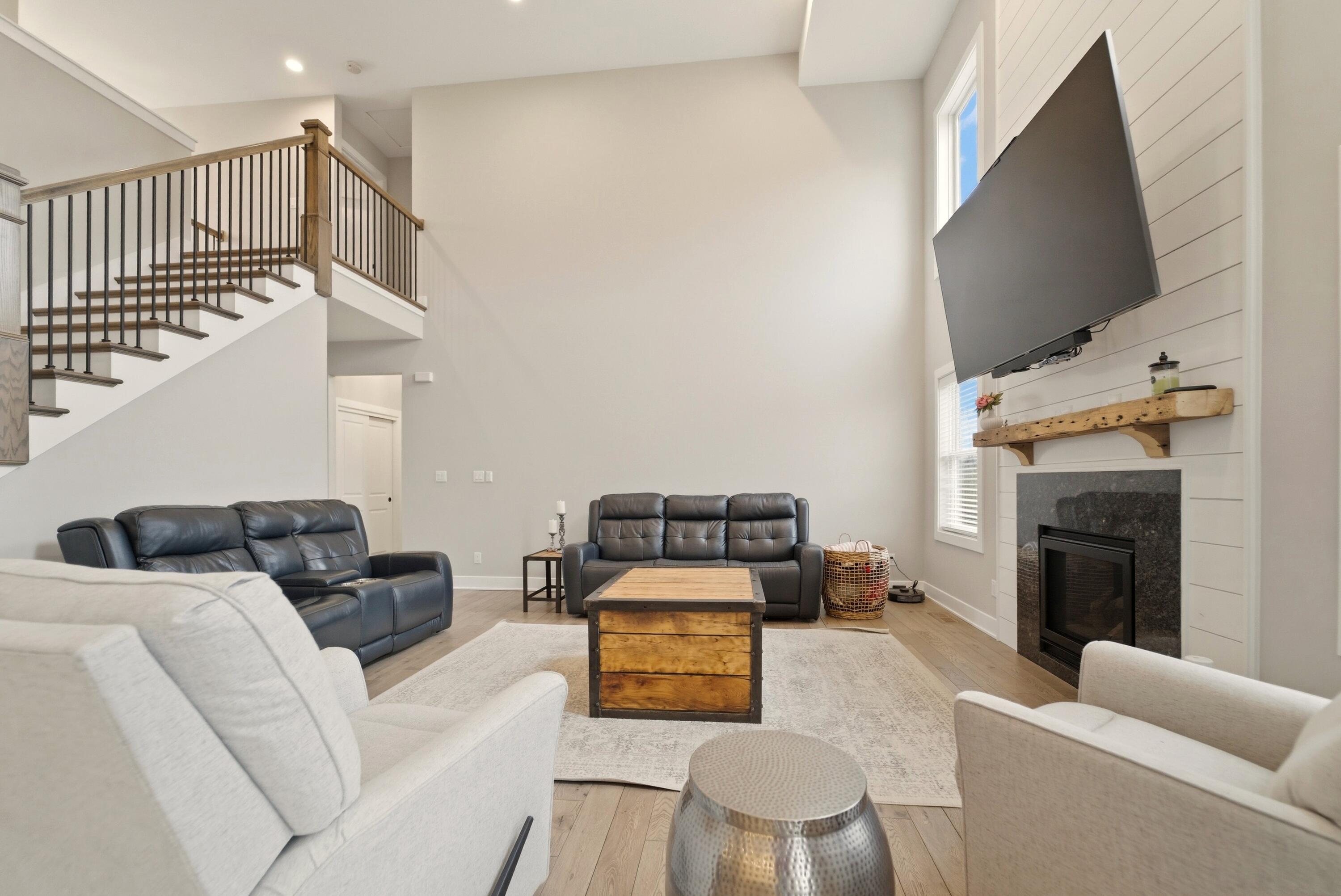 11200 Oak Ridge Court Crown Point, IN 46307 - Photo 14 of 43 a living room with furniture and a flat screen tv