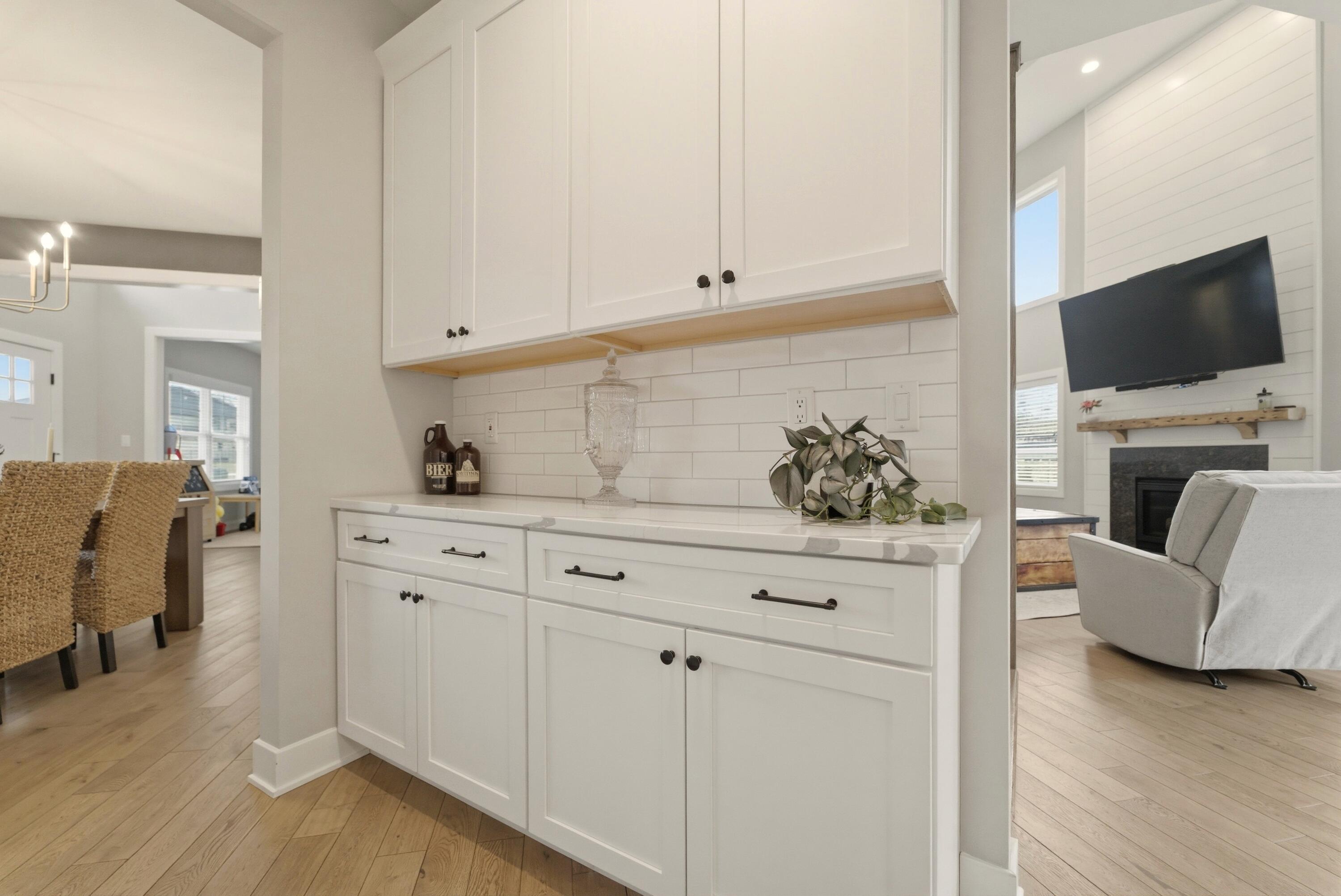 11200 Oak Ridge Court Crown Point, IN 46307 - Photo 15 of 43 a living room with furniture and a flat screen tv