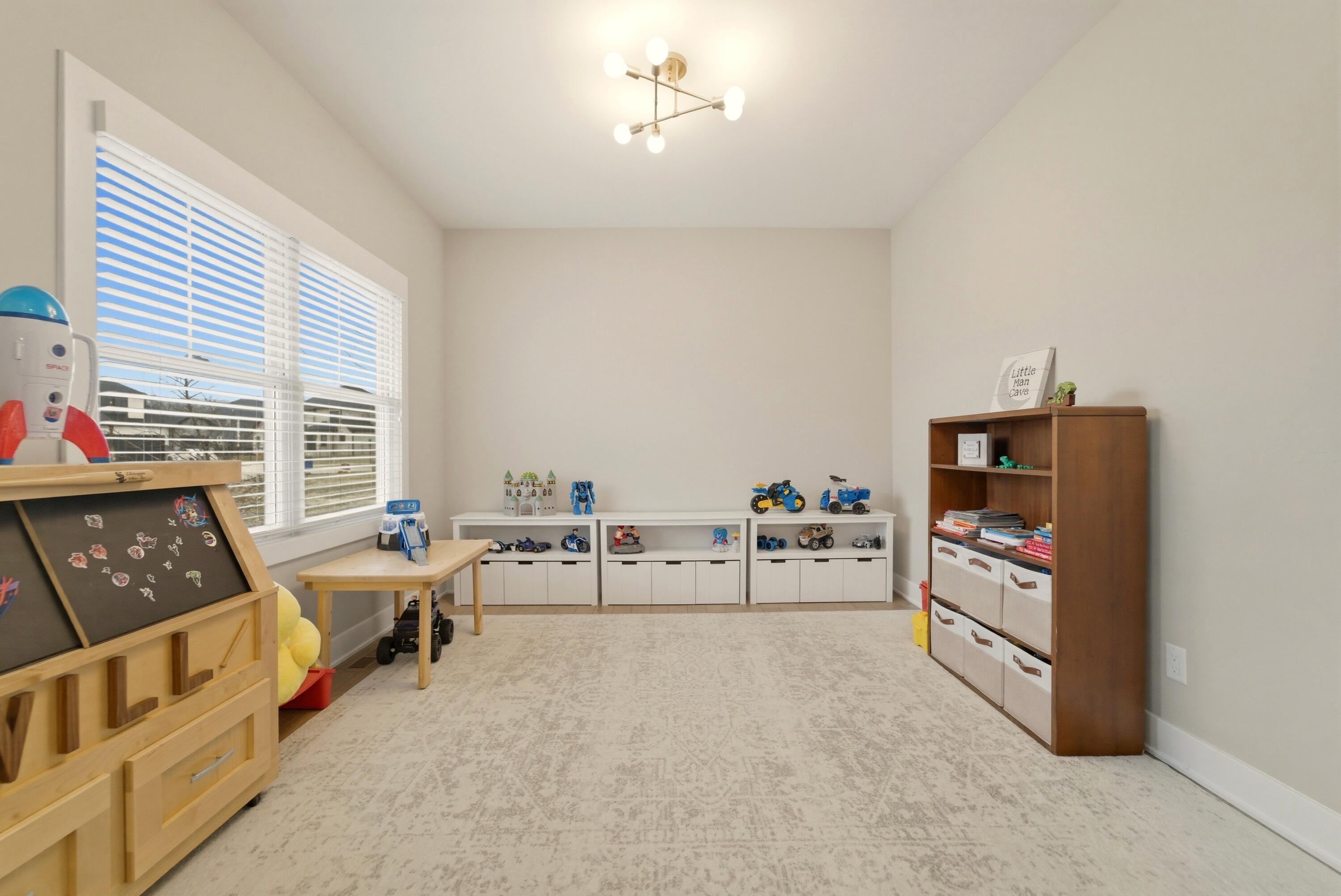 11200 Oak Ridge Court Crown Point, IN 46307 - Photo 18 of 43 a bedroom with furniture and a window
