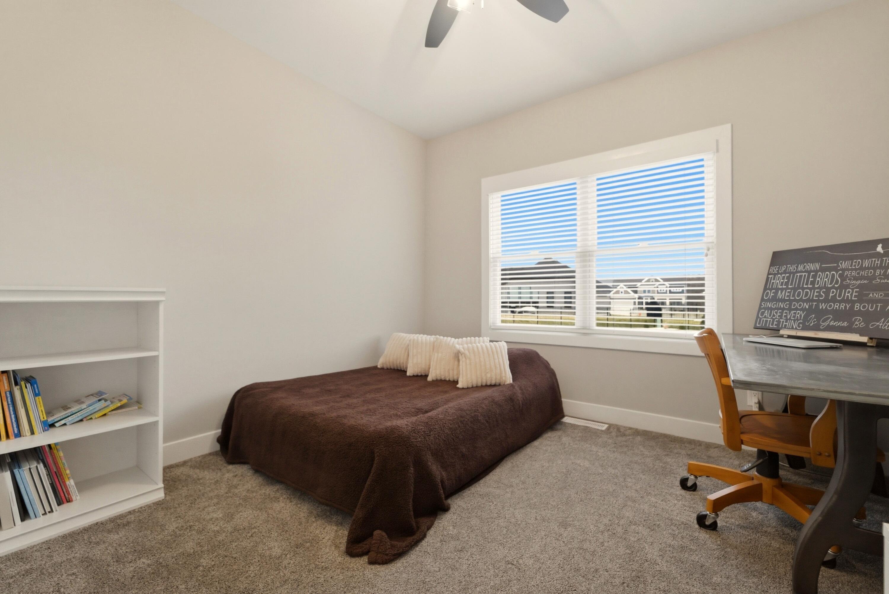 11200 Oak Ridge Court Crown Point, IN 46307 - Photo 21 of 43 a bedroom with bed and a window