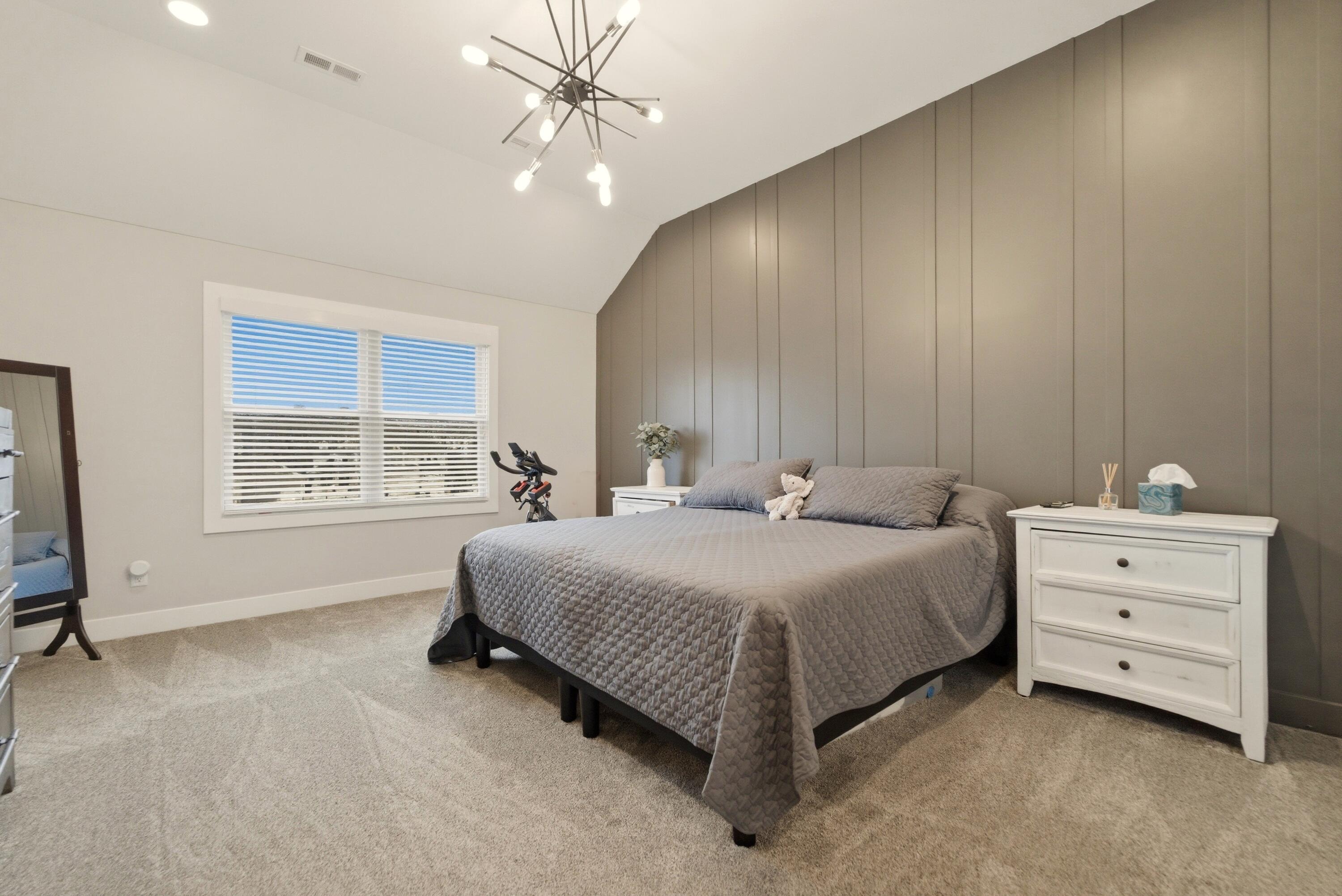 11200 Oak Ridge Court Crown Point, IN 46307 - Photo 24 of 43 a spacious bedroom with a bed and a window
