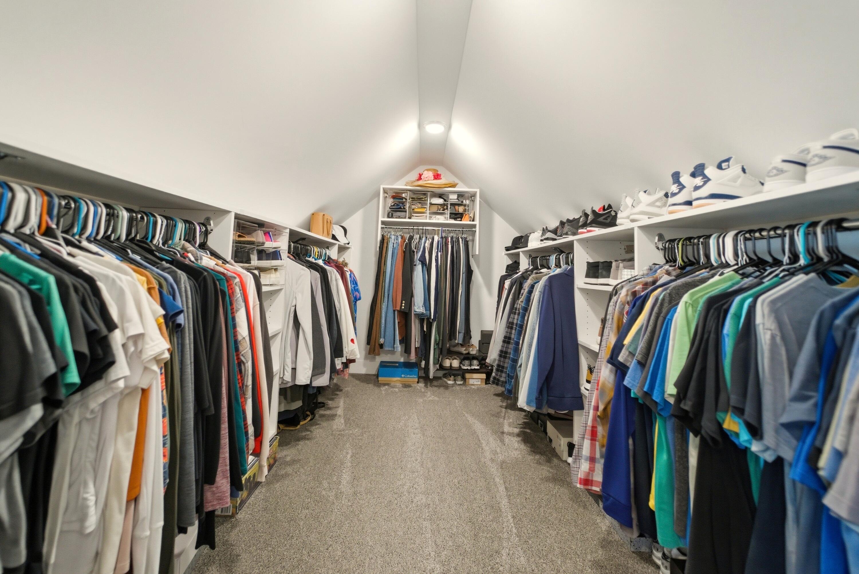 11200 Oak Ridge Court Crown Point, IN 46307 - Photo 30 of 43 a view of walk in closet with clothes and shoes