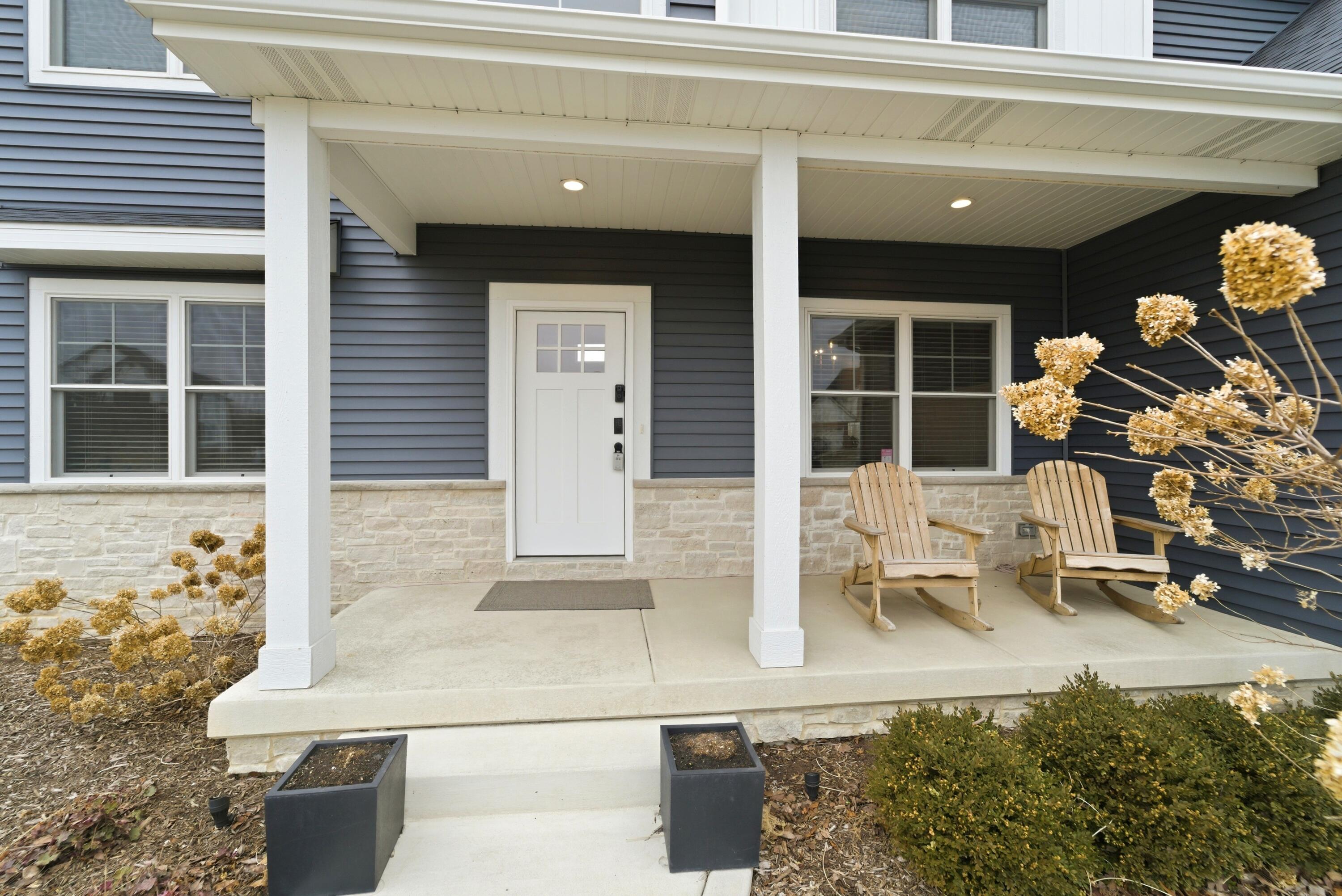 11200 Oak Ridge Court Crown Point, IN 46307 - Photo 3 of 43 a front view of a building with outdoor seating