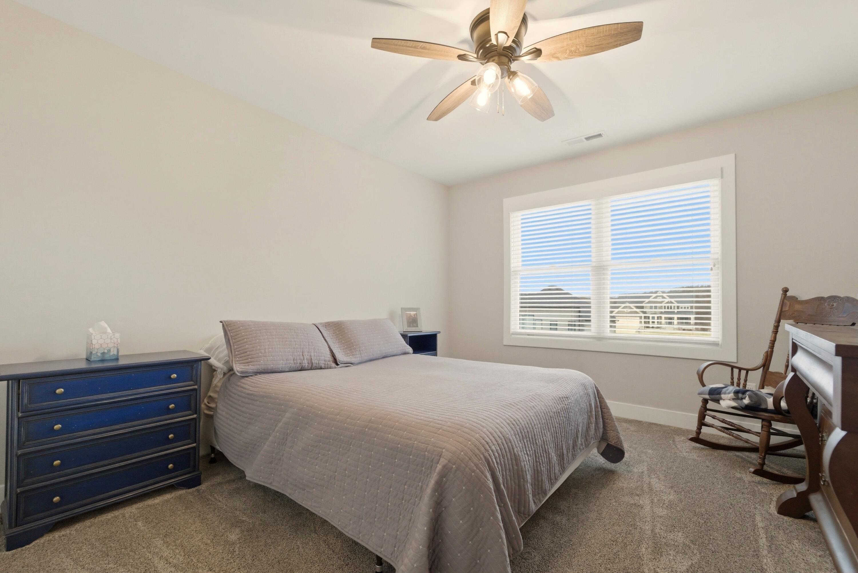 11200 Oak Ridge Court Crown Point, IN 46307 - Photo 33 of 43 a bedroom with a bed and a window