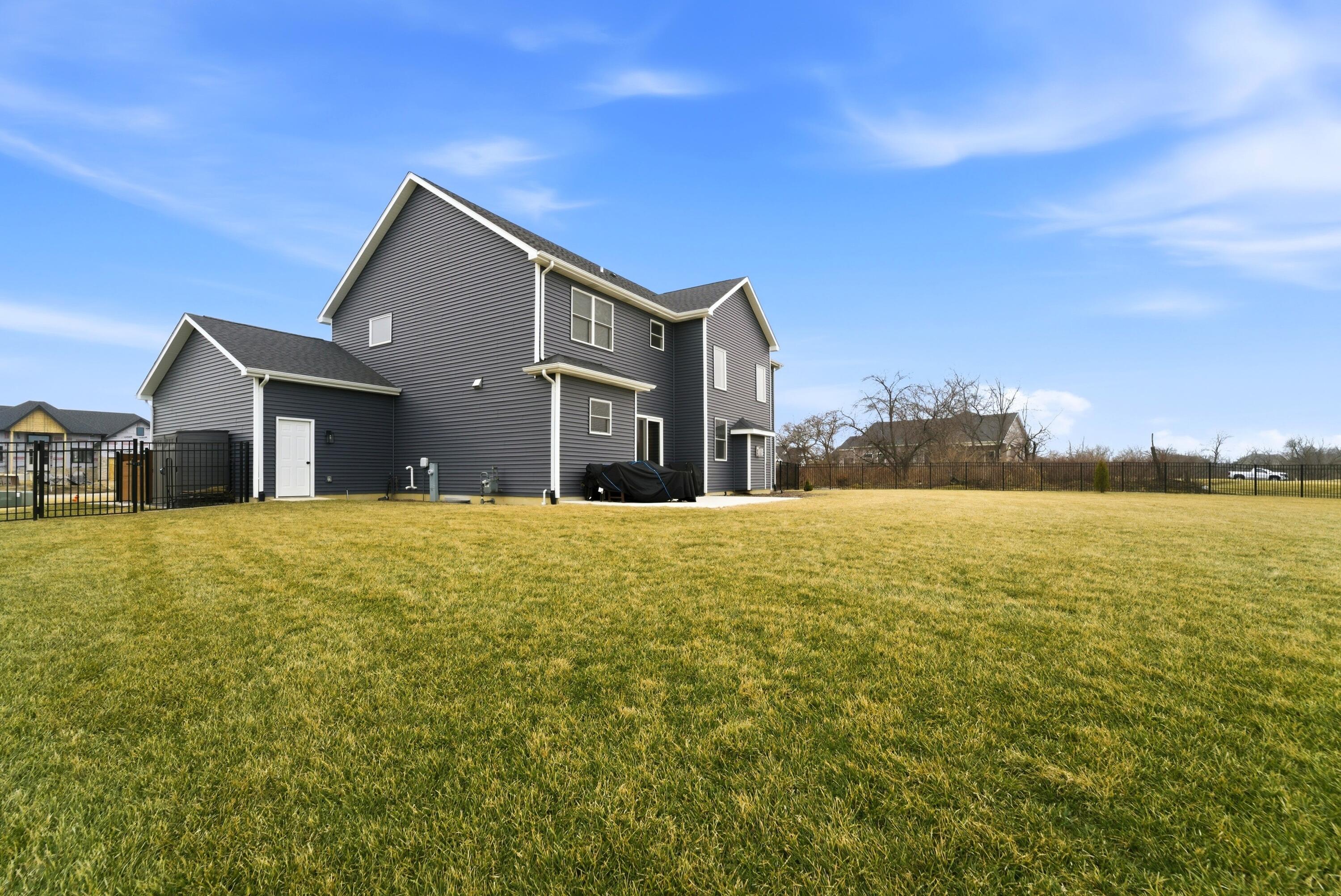 11200 Oak Ridge Court Crown Point, IN 46307 - Photo 37 of 43 a front view of a house with a yard