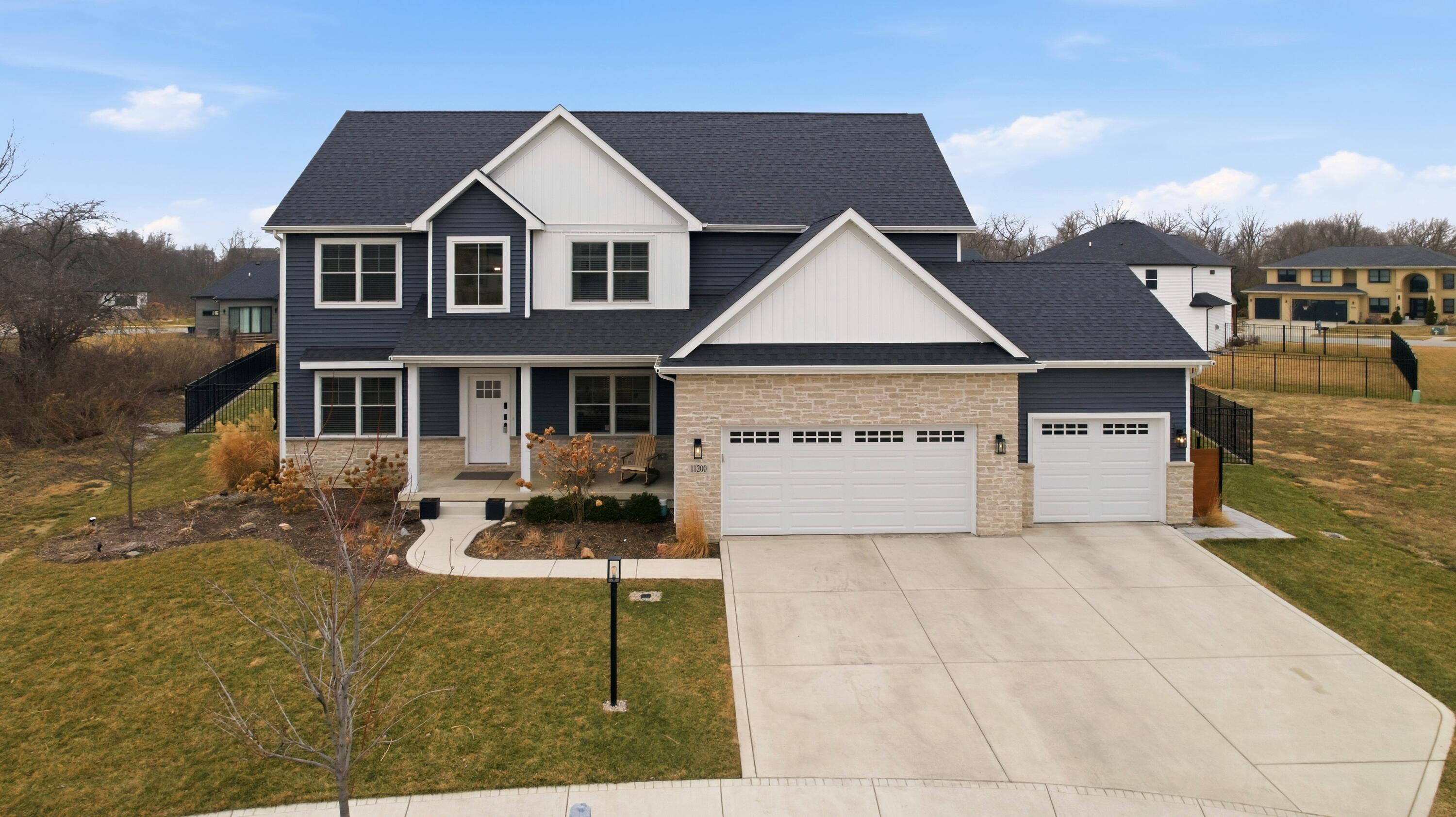 11200 Oak Ridge Court Crown Point, IN 46307 - Photo 42 of 43 a front view of a house with garden