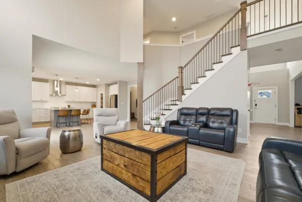 a living room with furniture and a dining table