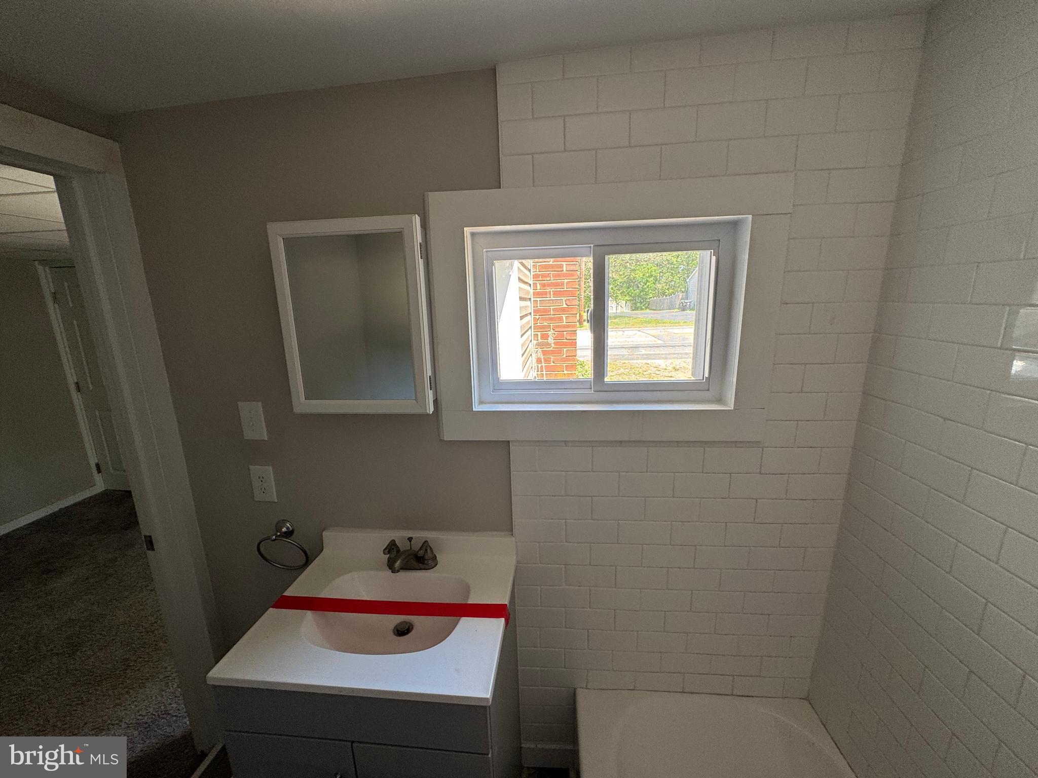 395 Tansboro Road Berlin, NJ 08009 - Photo 38 of 47 a bathroom with a sink and a window