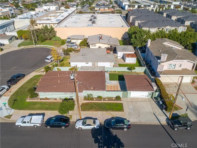 an aerial view of a house with a garden and swimming pool