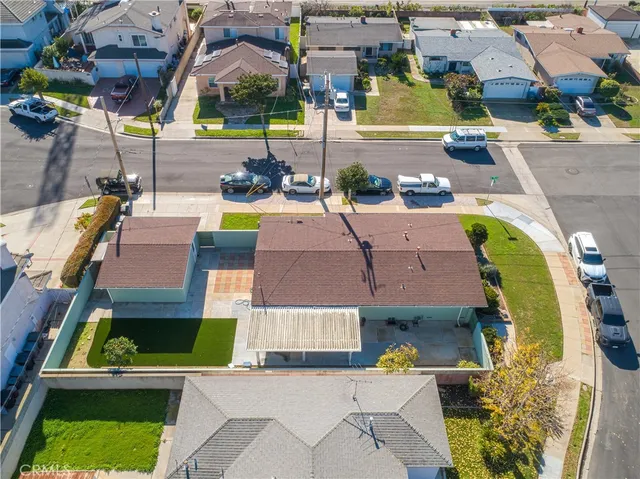 an aerial view of a house with a swimming pool