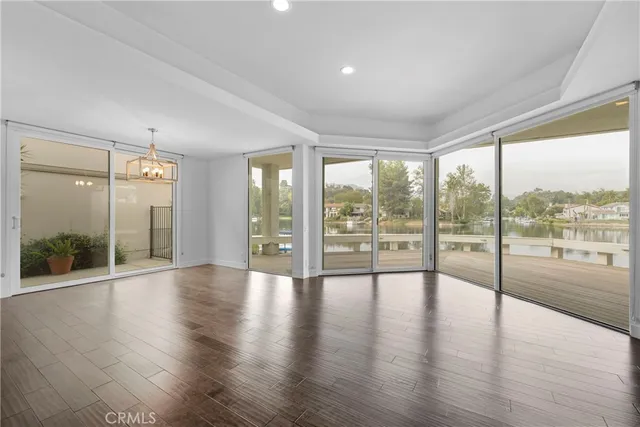 a view of an entryway with wooden floor
