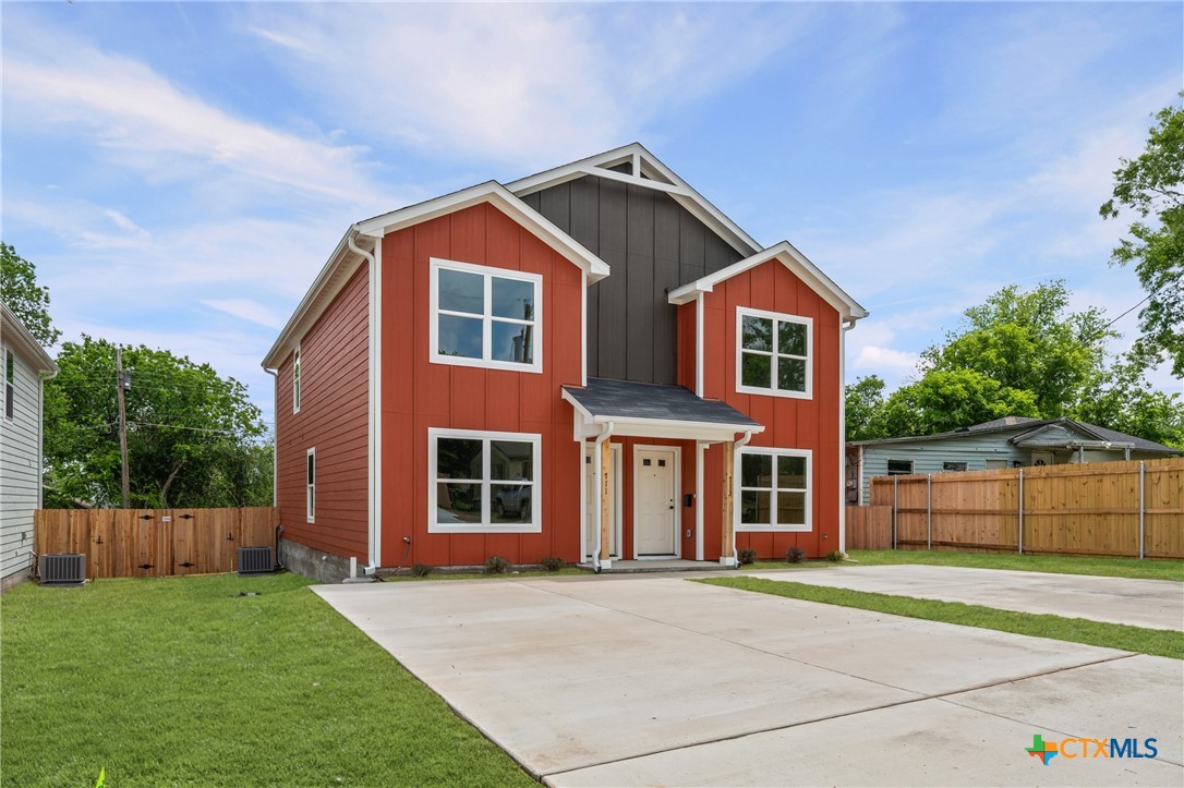 711 South 28th Street Temple, TX 76501 - Photo 2 of 26 a front view of a house with a garden