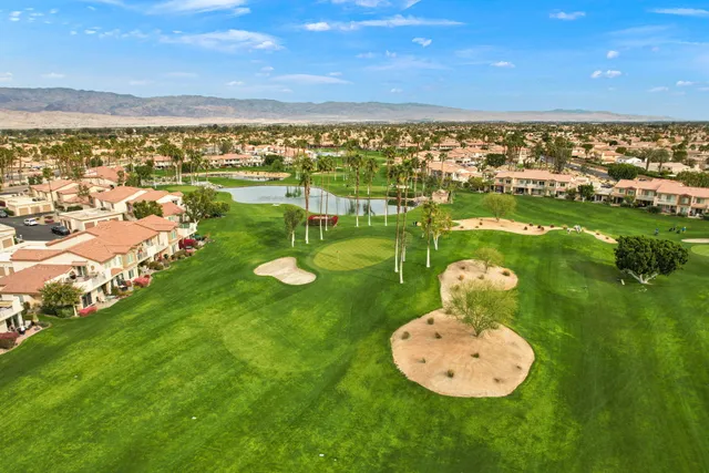 a view of a chairs and table in patio