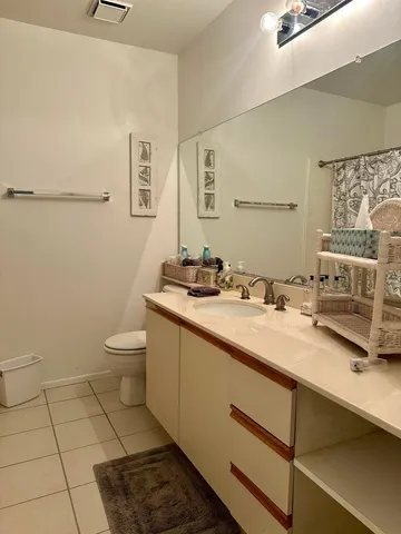 a bedroom with a bed and lamp