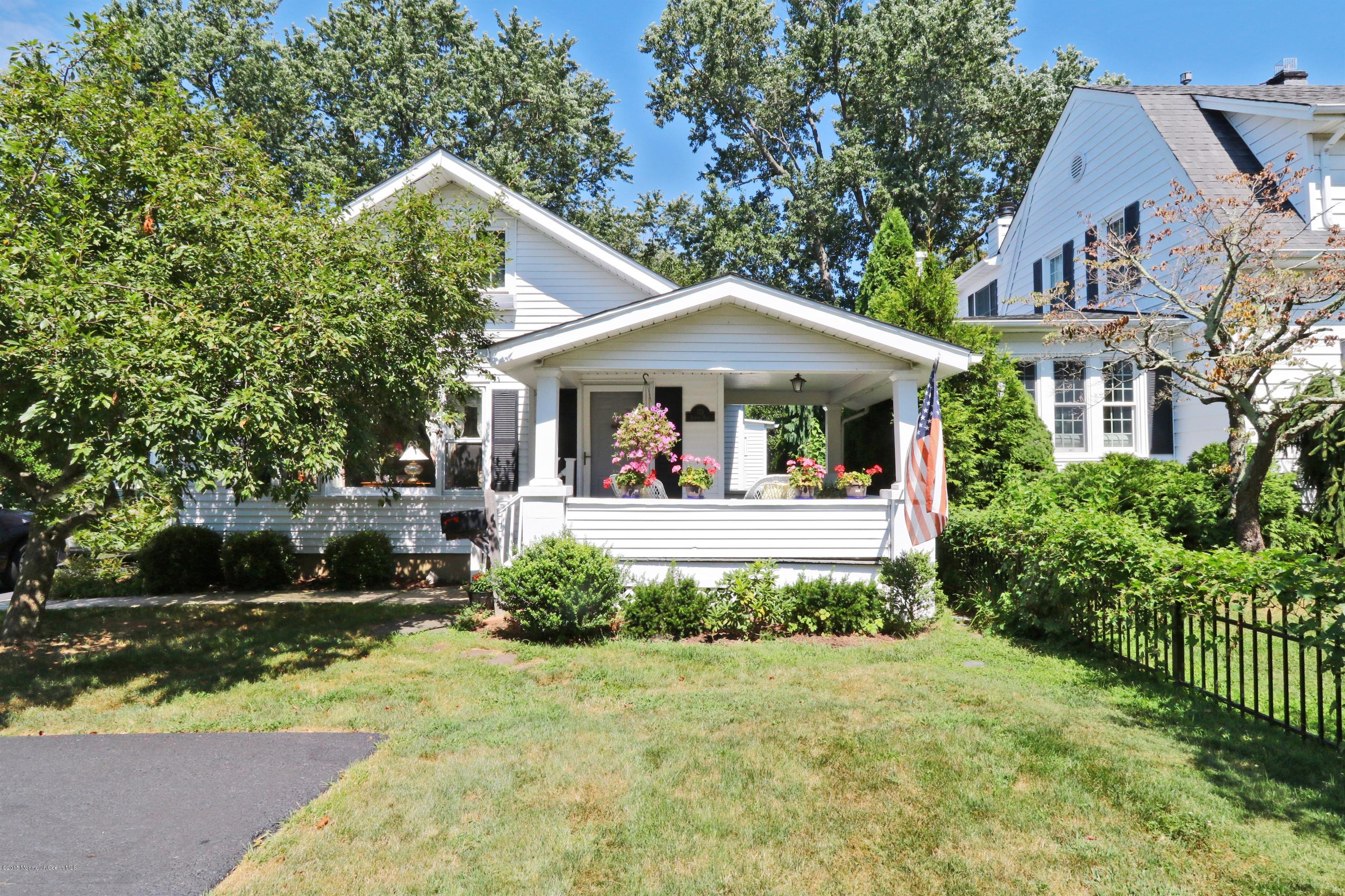 113 Rumson Road Little Silver, NJ 07739 - Photo 1 of 30 a view of a house with a small yard plants and large tree