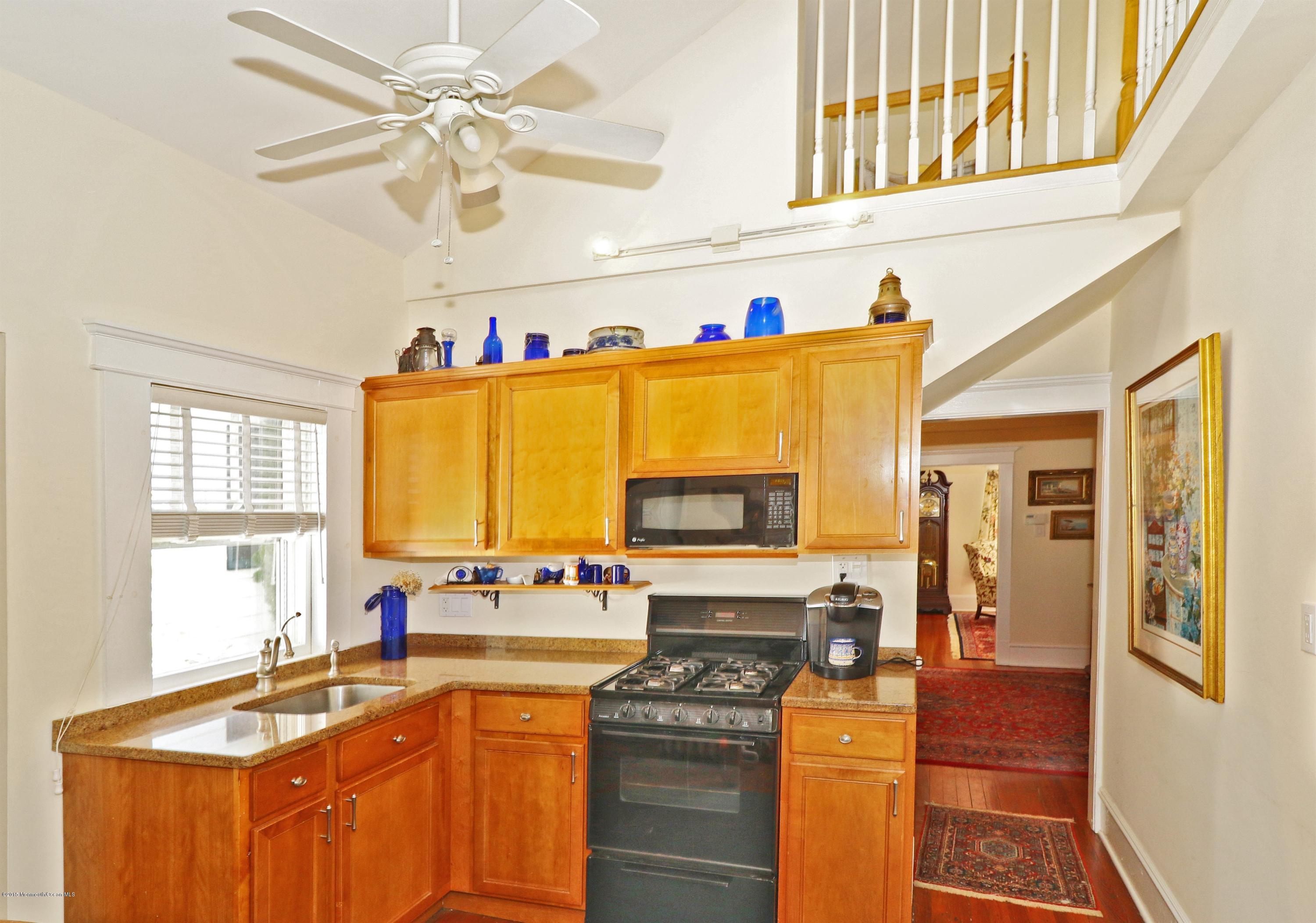 113 Rumson Road Little Silver, NJ 07739 - Photo 14 of 30 a kitchen with stainless steel appliances granite countertop a sink a stove and a refrigerator