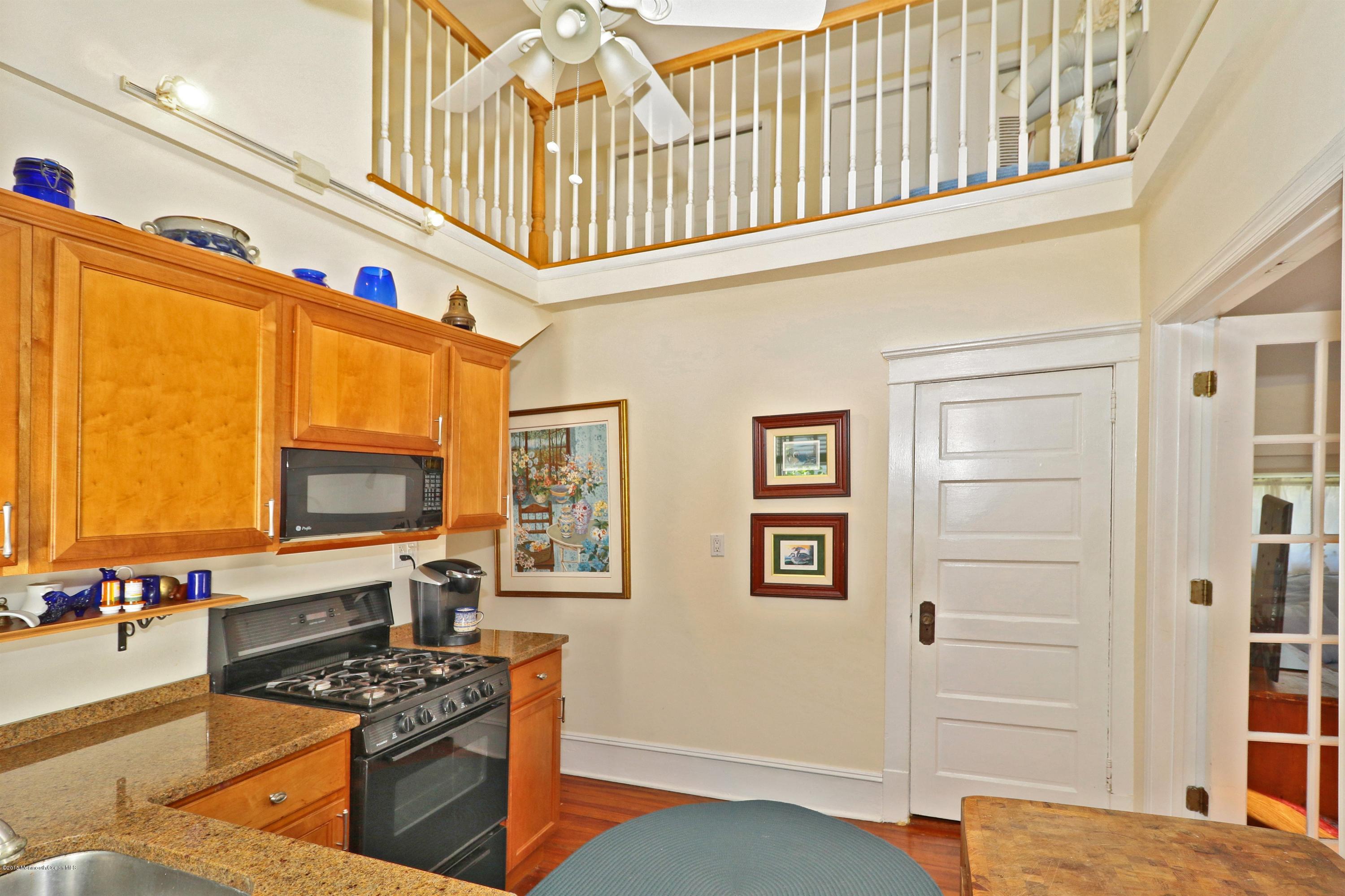 113 Rumson Road Little Silver, NJ 07739 - Photo 15 of 30 a kitchen with stainless steel appliances granite countertop a stove and a refrigerator