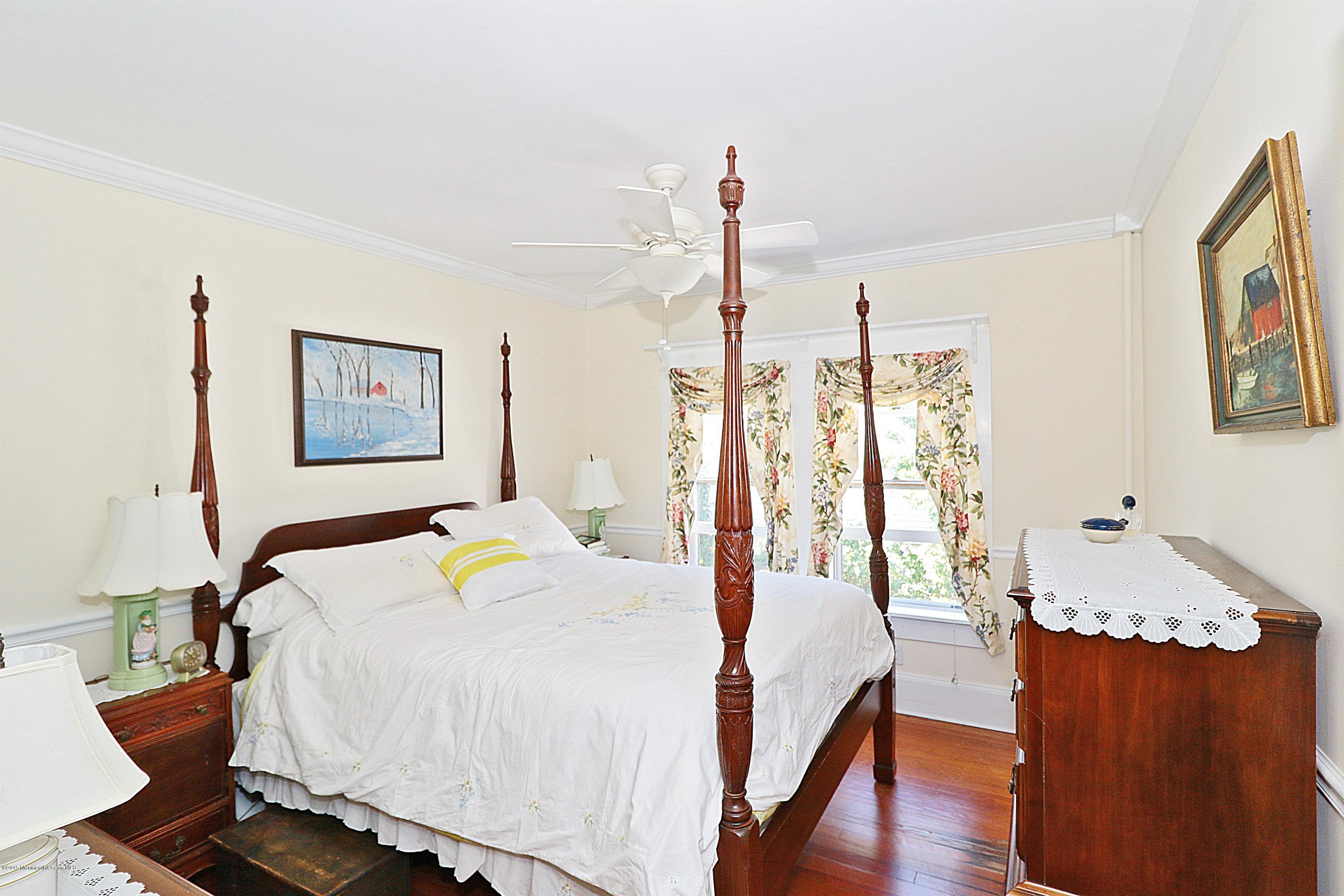 113 Rumson Road Little Silver, NJ 07739 - Photo 19 of 30 a bedroom with a bed and wooden floor