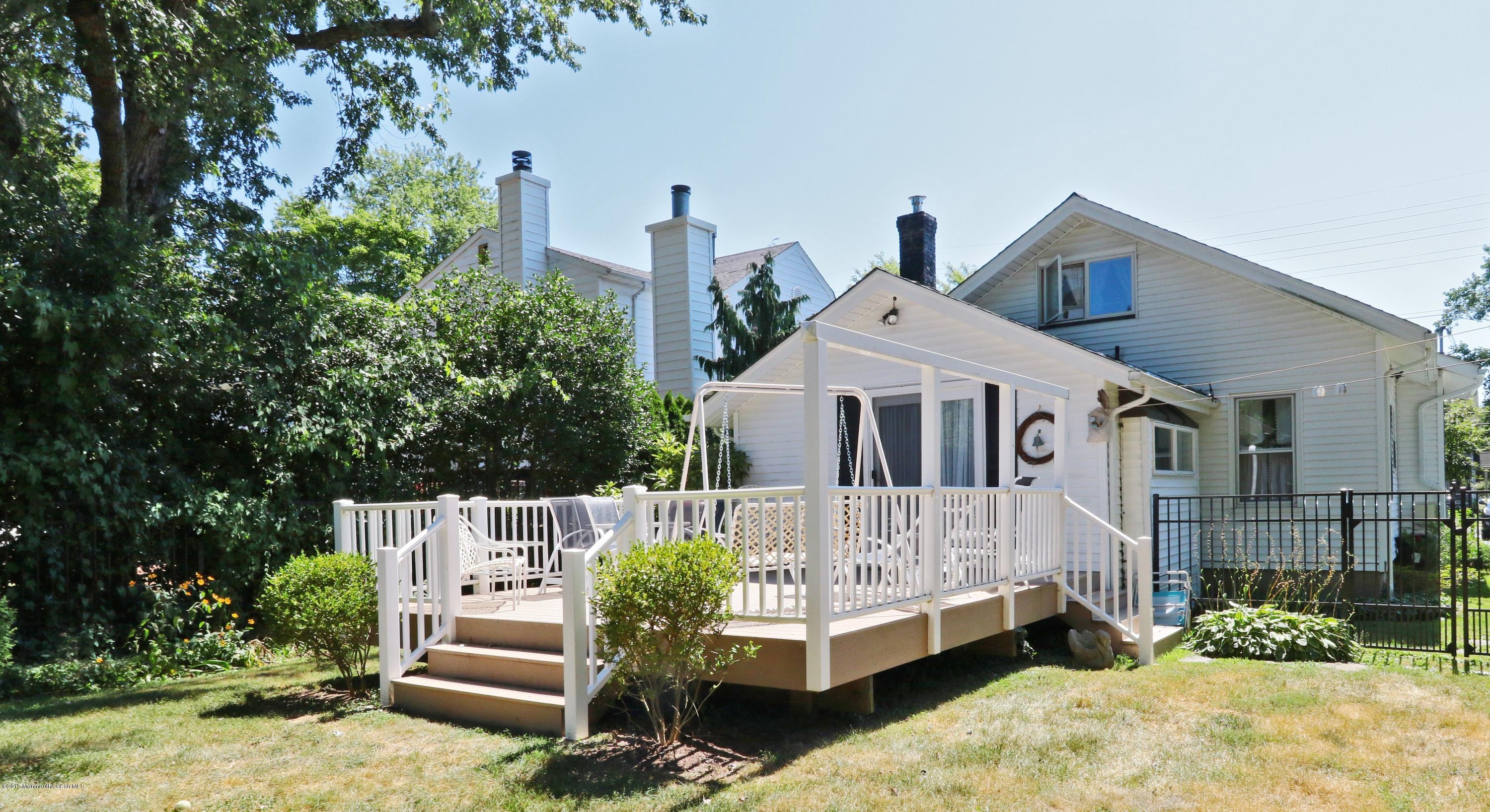 113 Rumson Road Little Silver, NJ 07739 - Photo 2 of 30 a front view of a house with a yard