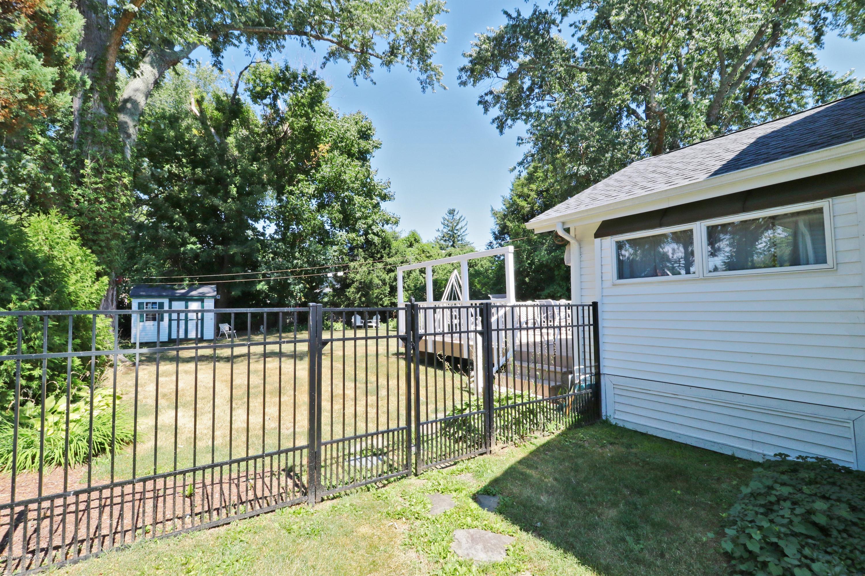 113 Rumson Road Little Silver, NJ 07739 - Photo 26 of 30 a view of a white house in the back yard
