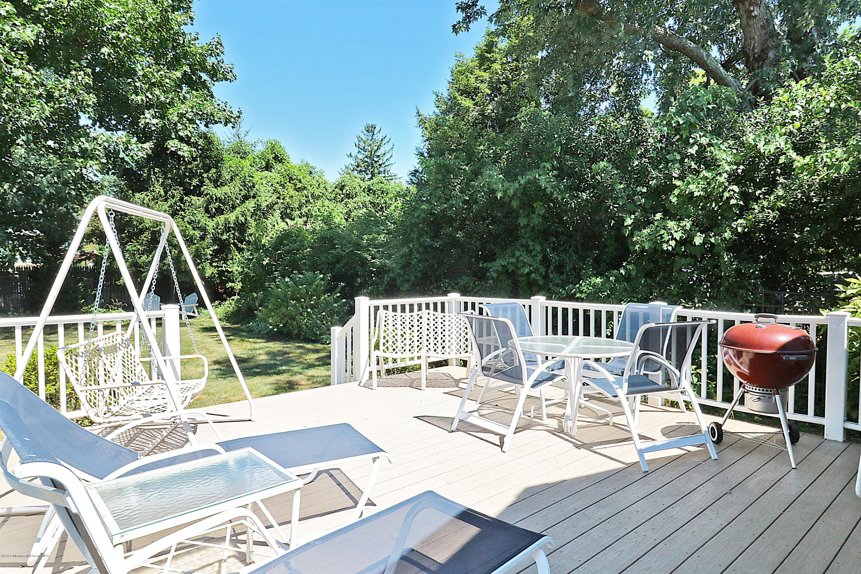 113 Rumson Road Little Silver, NJ 07739 - Photo 28 of 30 a view of a chair and tables on the roof deck