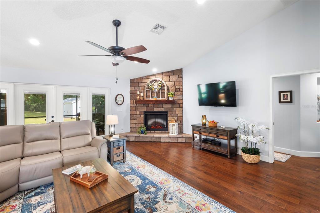 234 Geneva Heights Road Geneva, FL 32732 - Photo 12 of 57 All Electric Fireplace with Hearth and Mantle.