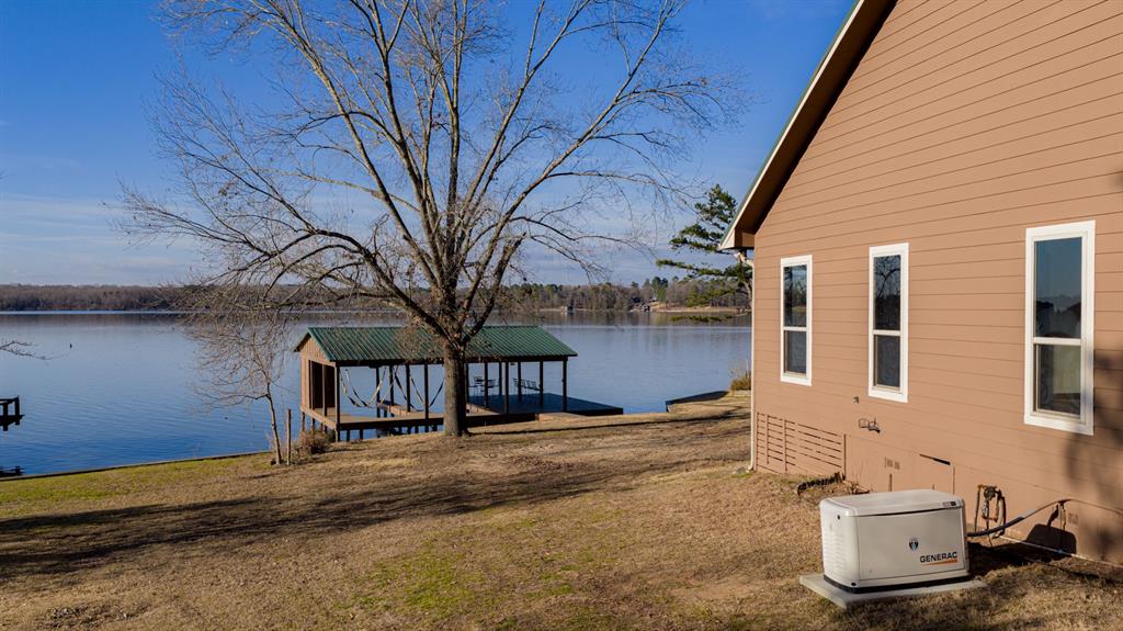410 Private Road Leesburg, TX 75451 - Photo 31 of 38 a view of a house with a yard