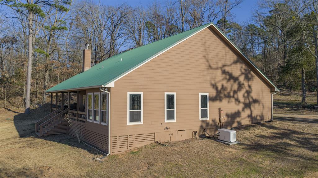 410 Private Road Leesburg, TX 75451 - Photo 32 of 38 a view of a house with a yard