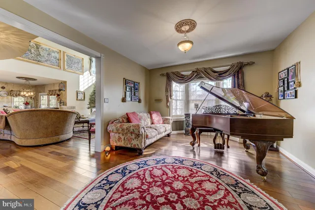 a room with lots of chairs and chandelier