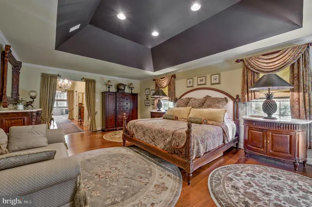 a spacious bathroom with a bathtub and shower