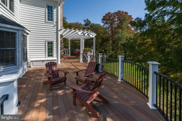 a front view of a house with porch and garden