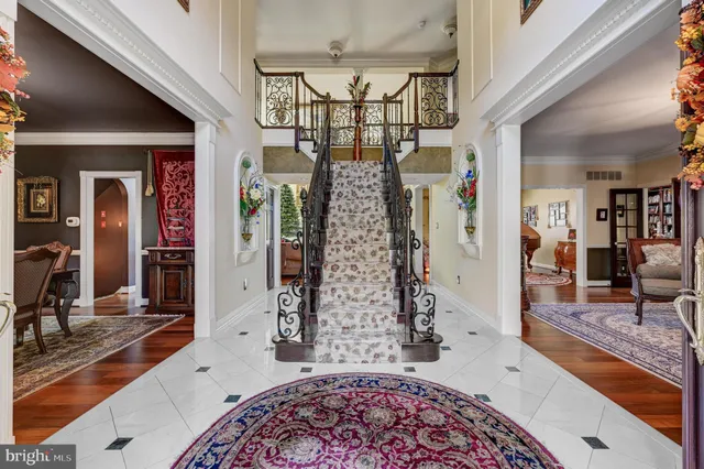 a living room with lots of furniture and a rug