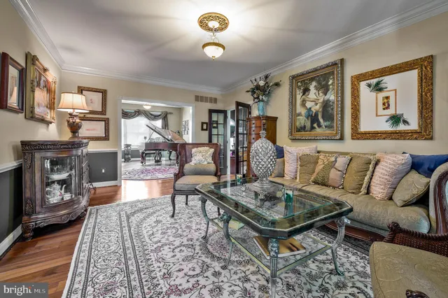 a living room with furniture and a rug